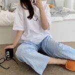 Women smiley print T-shirt with blue check pants two-piece set in Qatar